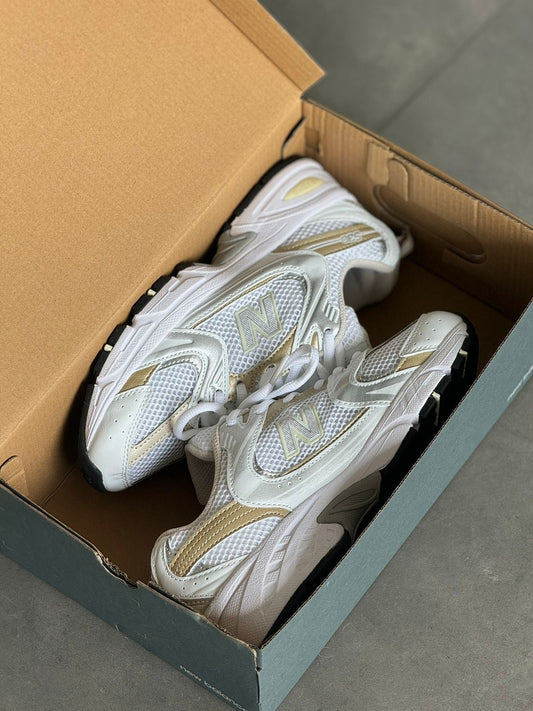 NEW BALANCE 530 BLANCO - DORADO